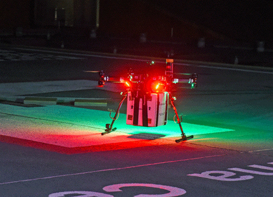 Drone dropping off a package at night