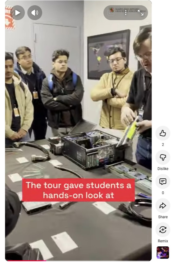 A video still from a Youtube Short. The screen reads, "The tour gave students a hands-on look at" with a man showing students a piece of equipment.