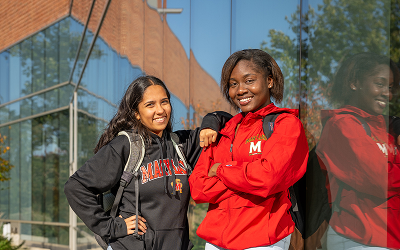 Student University of Maryland students stand proudly outside of Clark Hall