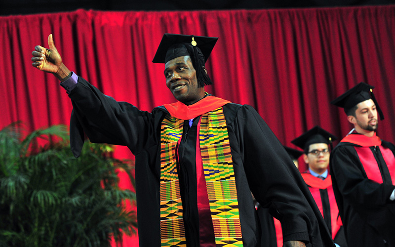 Graduated student giving a thumbs up